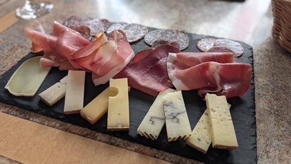 A slate of cured ham, saucisson and local cheeses in Domme